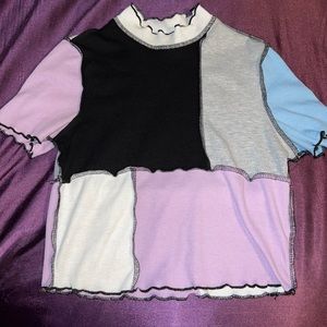 Light purple, black, gray and blue crop top